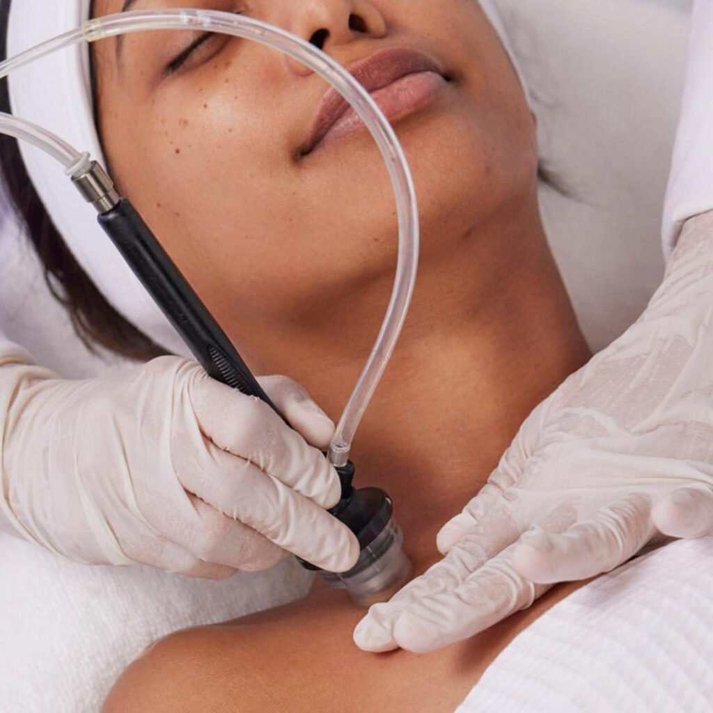 Woman getting a Diamond Glow facial treatment