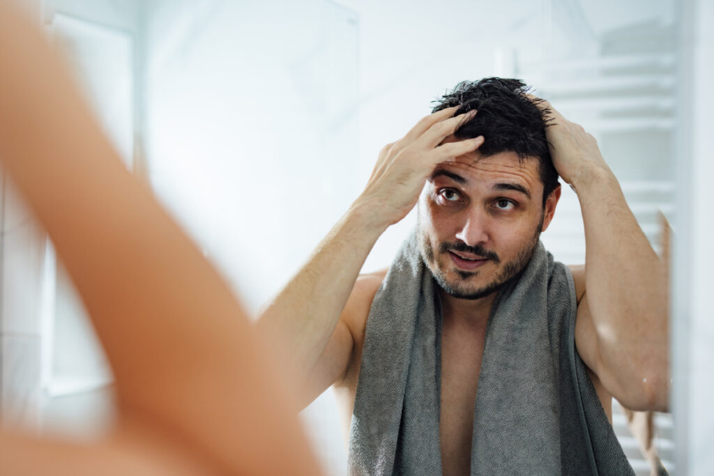 Man caring for hair after a NeoGraft hair transplant